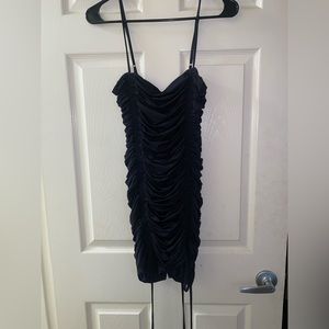 Tight fitting black mini dress